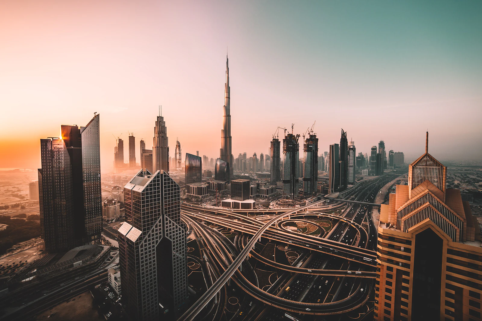 Dubai skyline and highway interchange at dawn
